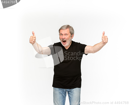 Image of Closeup of senior man\'s body in empty black t-shirt isolated on white background. Mock up for disign concept