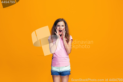 Image of Isolated on yellow young casual teen girl shouting at studio