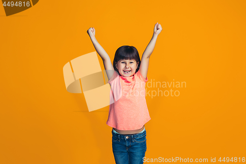 Image of Happy success teen girl celebrating being a winner. Dynamic energetic image of female model