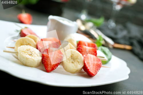 Image of banana with strawberry