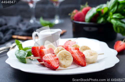 Image of banana with strawberry