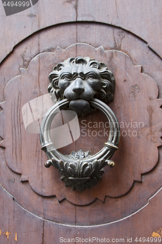 Image of Ancient italian lion shaped door knocker.