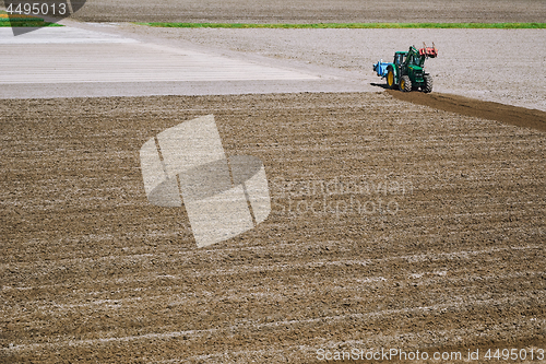 Image of Tractor in a Field