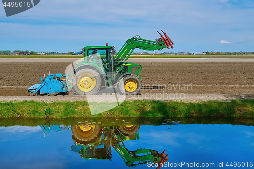 Image of Tractor in a Field