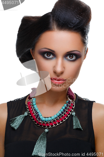 Image of Beautiful girl with bright vivid purple and green make-up 