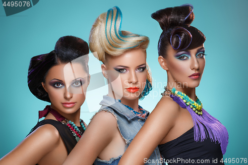 Image of Beautiful girls with fancy hairstyles and vivid makeup