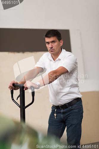 Image of designer in his furniture manufacturing workshop