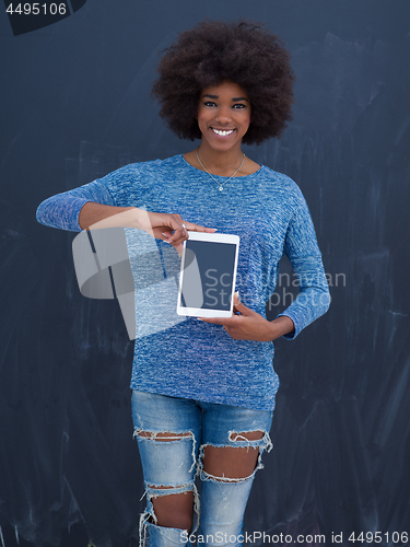 Image of Happy African American Woman Using Digital Tablet