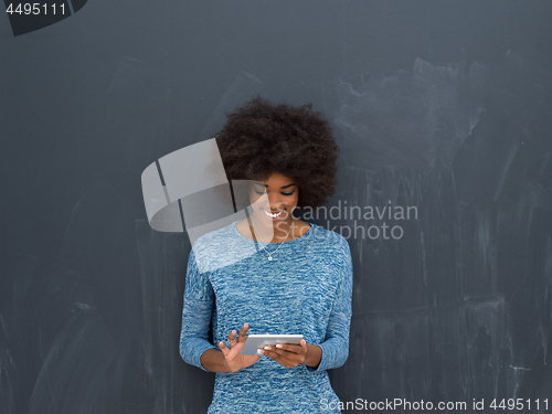 Image of Happy African American Woman Using Digital Tablet