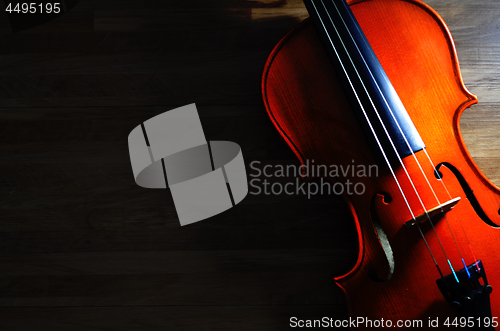 Image of Violin on rustic wooden background