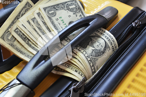 Image of Suitcase with US Dollar banknotes