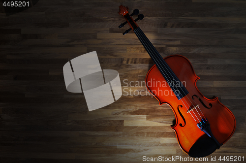 Image of Violin on rustic wooden background