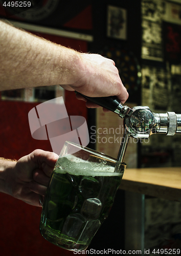 Image of Pouring the green beer