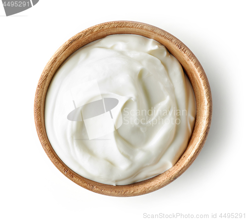 Image of sour cream or yogurt in wooden bowl