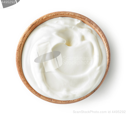 Image of sour cream or yogurt in wooden bowl