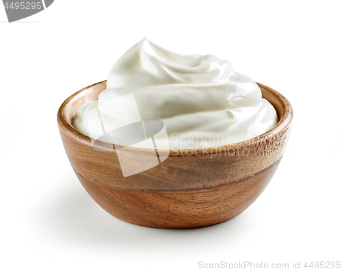 Image of sour cream in wooden bowl