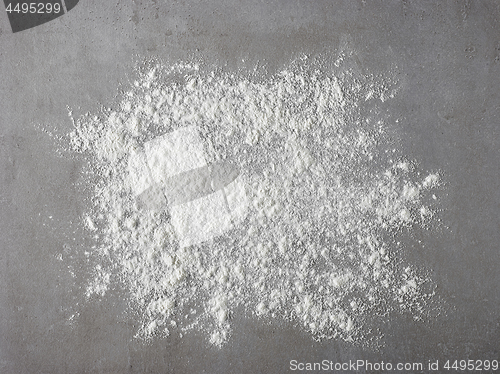 Image of white flour on grey kitchen table