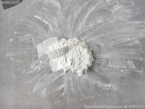 Image of white flour on grey kitchen table