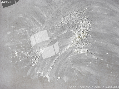 Image of white flour on grey kitchen table