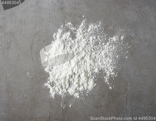 Image of white flour on grey kitchen table