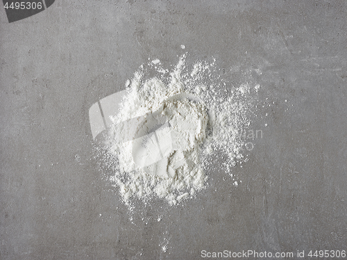 Image of white flour on grey kitchen table