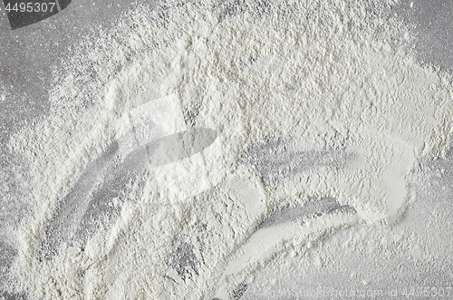 Image of white flour on grey kitchen table