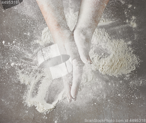 Image of bakers hands with flour in motion