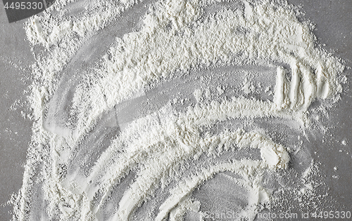 Image of white flour on grey kitchen table