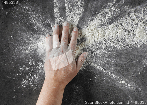 Image of bakers hand with flour 