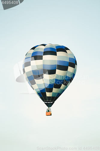 Image of Blue hot air balloon in the clear sky