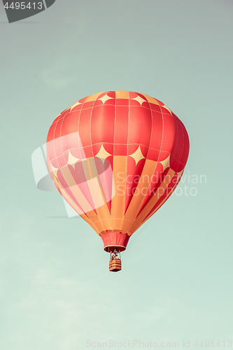 Image of Orange hot air balloon in the sky