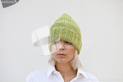 Image of Beautiful young woman in warm green beanie