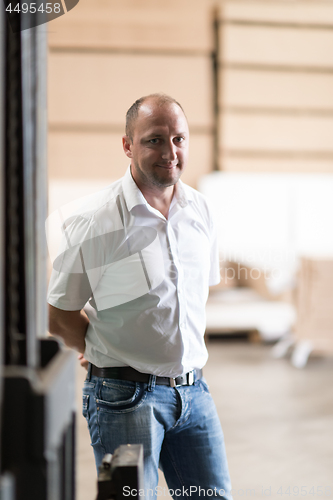 Image of designer in his furniture manufacturing workshop