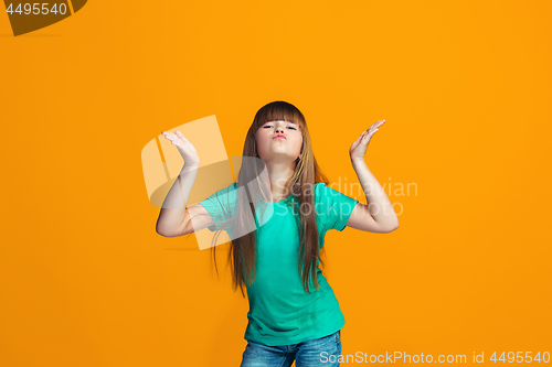 Image of Happy success teen girl celebrating being a winner. Dynamic energetic image of female model