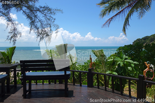 Image of Tropical beach with deckchair 