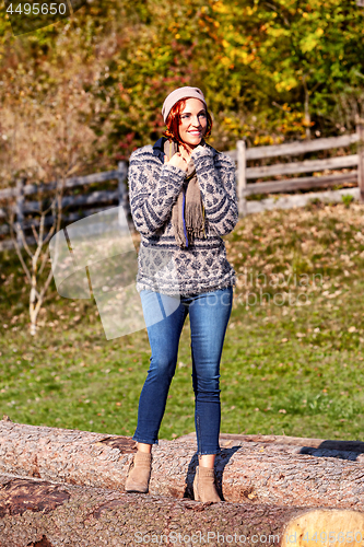 Image of Woman in autumnal park