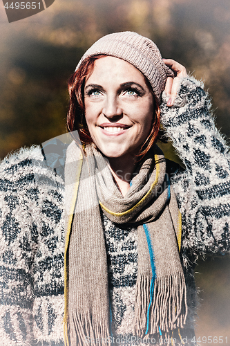 Image of portrait of a smiling woman in snow