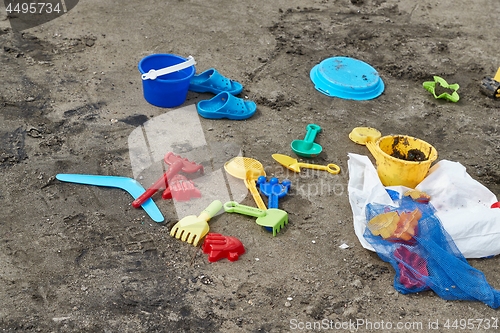 Image of Plastic xhild toys on the beach