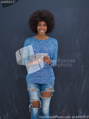 Image of Happy African American Woman Using Digital Tablet