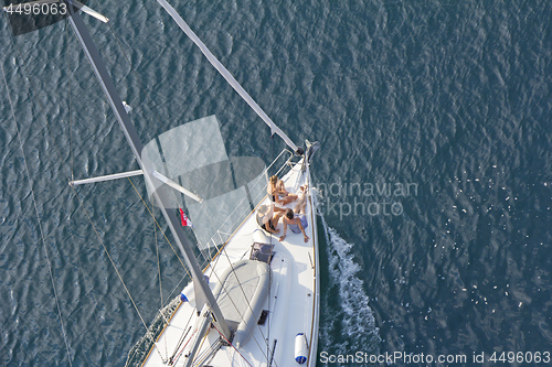 Image of Three young Girls at bow of yacht