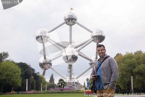 Image of portrait of man in front of atomium building in Brussels