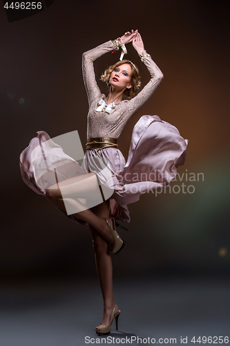 Image of Beautiful girl in lace silk dress