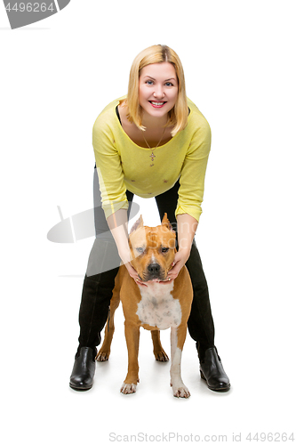 Image of Girl with amstaff dog