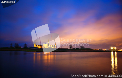 Image of Kronborg Castle at night seen from Elsinore harbour