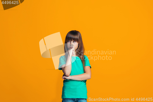 Image of Young serious thoughtful teen girl. Doubt concept.