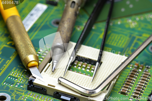 Image of Tools on the motherboard of the laptop