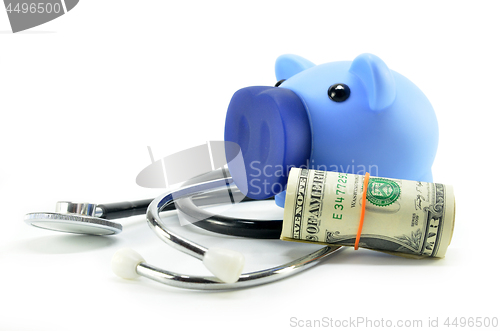 Image of Stethoscope and piggy bank