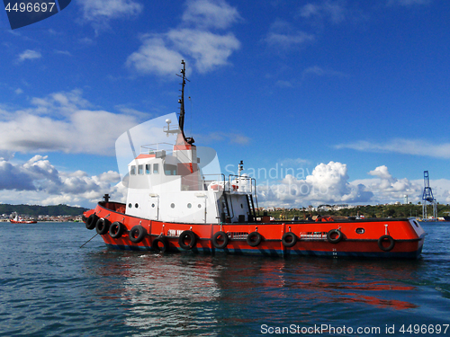 Image of Red Tug at Anchorage.