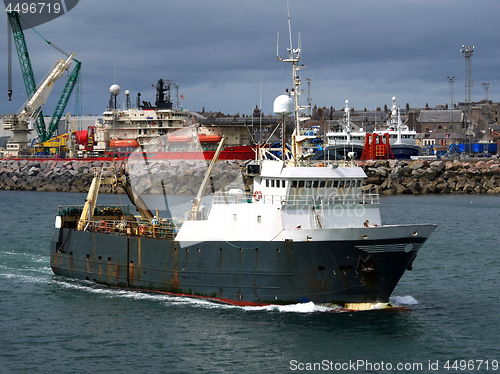 Image of Trawler Leaving Port.