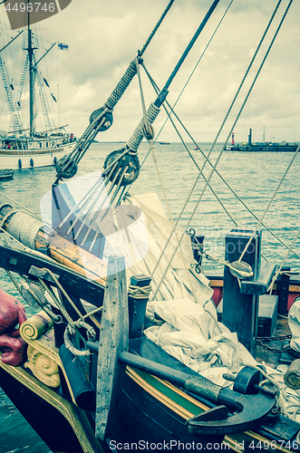 Image of Old sailboat in the harbor, toning